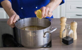 Pour soy sauce and lemon juice into the pan, add garlic, salt and pepper. Cook the soup for another 20 minutes on low heat. Before serving, garnish with chopped parsley. Bon appetit!