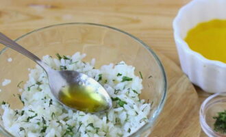 Rinse the rice several times and let it cook. Bring it to readiness, drain off excess water, cool, add chopped herbs, salt and melted butter.