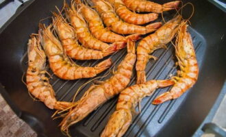 Lightly salt the langoustines and roll in spices, fry on both sides for 2 minutes. 