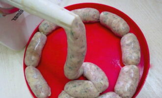 Using a special sausage maker, fill the porridge with minced meat and form into small sausages. Place them in the refrigerator for 3 hours, after which you can start cooking.