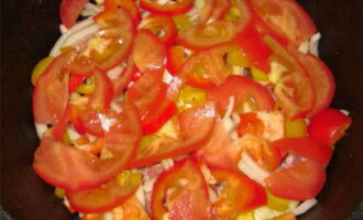 Next, layer again with 1/3 of the onions, peppers and tomatoes. 