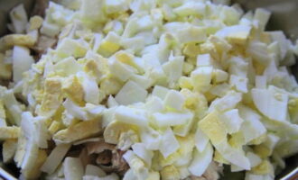 Also cut the hard-boiled eggs into cubes and place in a salad bowl.