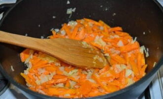 Chop the onion and carrots and simmer in vegetable oil until soft.