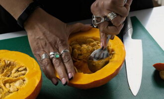 Preheat the oven in advance (temperature – 200 degrees). Remove the seeds from the pumpkin halves with a tablespoon. Place the halves on a baking sheet. Place the pumpkin in the oven. 