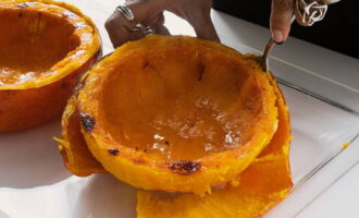 Let the pumpkin cool slightly and separate the pulp from the peel with a spoon. 