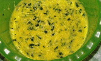 Add cheese and herbs to the egg mixture and mix.