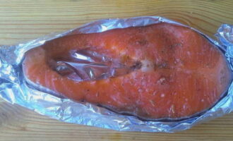 Fold the edges of the foil so that the top of the salmon is exposed.