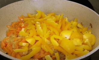 Then place the sweet pepper cut into strips into the frying pan. Stir the vegetables a little while frying. During this time, the cabbage will become soft and decrease in volume. You can salt it to your taste.