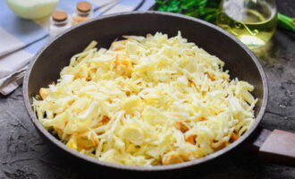 Next, add cabbage, salt and ground pepper, stir and simmer the dish under the lid for 25 minutes over low heat.