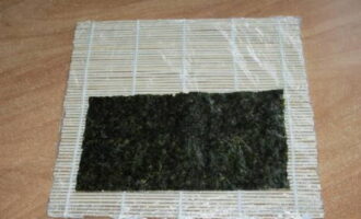 Place sheets of nori on one mat.