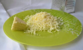 Crab sticks in batter in a frying pan are very easy to prepare. Grate hard cheese on a grater with large or medium teeth.