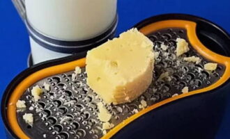 Grate hard cheese.