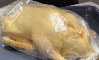 Place the duck in the sleeve and tie the edges tightly. Place the duck on a baking sheet. Place the baking sheet with the bird in an oven preheated to 180 degrees and bake for an hour and a half.