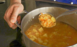 Now cover the pan with a lid and continue to cook the soup over low heat until the peas look like puree.