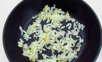 First, fry the onion in a frying pan.