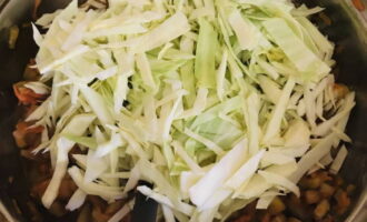 Finely chop the white cabbage. Add it to the rest of the vegetables.