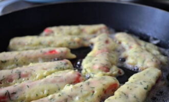 Fry the sticks in vegetable oil until golden brown.