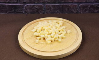 Cut the hard cheese into squares the same size as the meat.