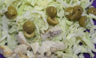 We lay out the products with the cabbage. We also send halves of olives here.