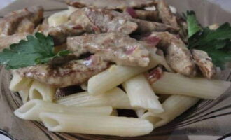 Serve the finished Stroganoff-style liver with a side dish of your choice.