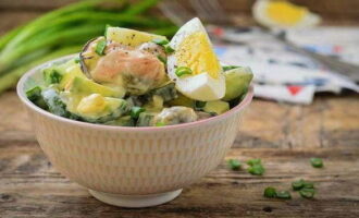 Garnish the salad with fresh herbs and serve.