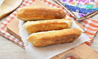 The sausages in yeast dough are ready. You can serve it to the table. Bon appetit!