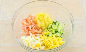 Boil the shrimp in salted water until tender, cool and peel. Cut the sweet pineapple into cubes and combine all the prepared products in a deep plate.