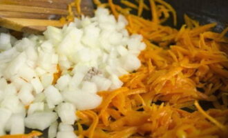 Saute the carrots in vegetable oil, then add the onion. 