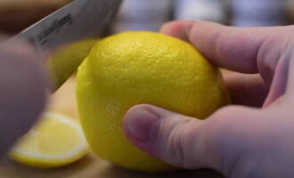 The lemon is thoroughly washed and cut into two halves.