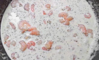 Simmer them in cream for 3 minutes, if your shrimp are pink (boiled-frozen), and if gray (raw), then for 6 minutes from the start of the boil and over low heat.