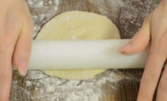 Roll each piece into a not very thin flat cake.