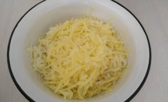 Grind the potatoes using a large-hole grater.