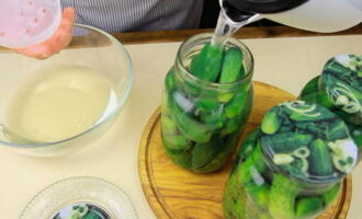 Boil clean water. Pour boiling water over the cucumbers, cover with lids and leave for 10 minutes. Then drain the water from the cans and refill with boiling water for the same time.