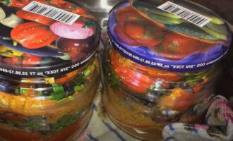 Cover jars of tomatoes with lids and sterilize for 10 minutes, like all home-canned goods.