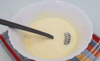 Then add soft butter with sour cream at room temperature and mix these ingredients with a whisk until smooth.