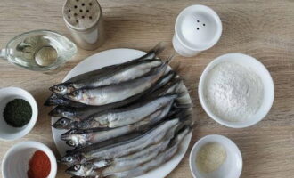 Fried capelin in a frying pan is very easy to prepare. Gather the ingredients from the list. If you use frozen fish, defrost it in advance.