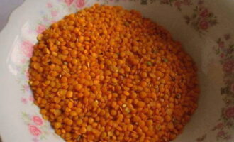 Wash the red lentils and add them to a pan of boiling water.