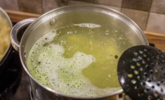 Wait until the broth boils again and reduce the temperature slightly.