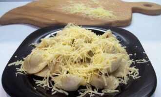 Fried dumplings with cheese in a frying pan are ready. Serve to the table!