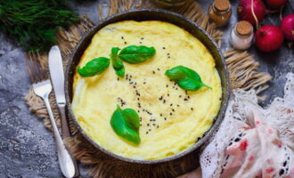 When the eggs are completely set and the omelette mixture is cooked through, remove the pan from the stove.