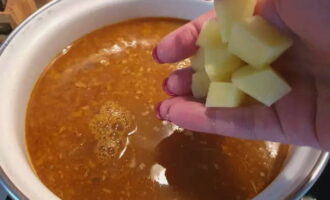 Chop the remaining potatoes into cubes and add to the soup.