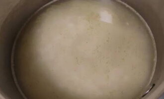 Place the pan on the stove. Boil it. Cover with a lid. Select minimum heat. Cook for 15 minutes.