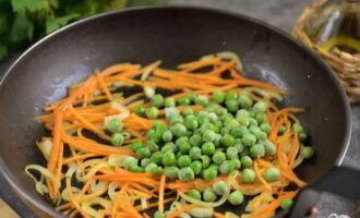 Add green peas to the soft vegetables, stir and simmer for another two minutes.