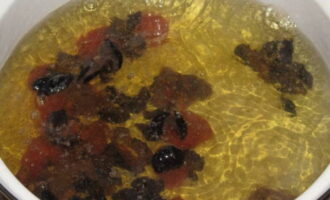 Place dried apricots, figs and prunes into a separate pan with boiling water.