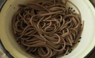 Drain the cooked noodles through a sieve or colander. Rinse with boiled water.