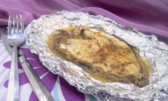 Catfish steaks in foil in the oven are ready. Serve and enjoy!