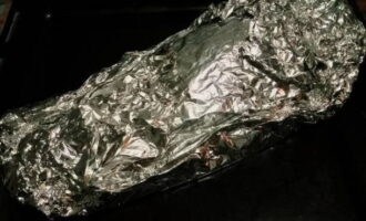 Wrap the fish in foil and cook for one hour at 200 degrees.