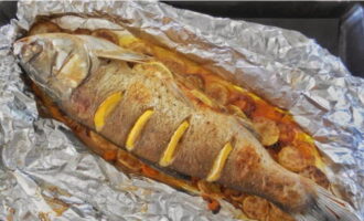 After 30 minutes, open the foil and bake the fish for another 15 minutes.