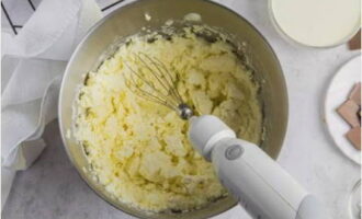 Place the cheese in a deep bowl and also add two types of granulated sugar - beat with a mixer at low speed.