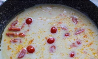 Pour the egg-milk mixture over the tomatoes and stir lightly.